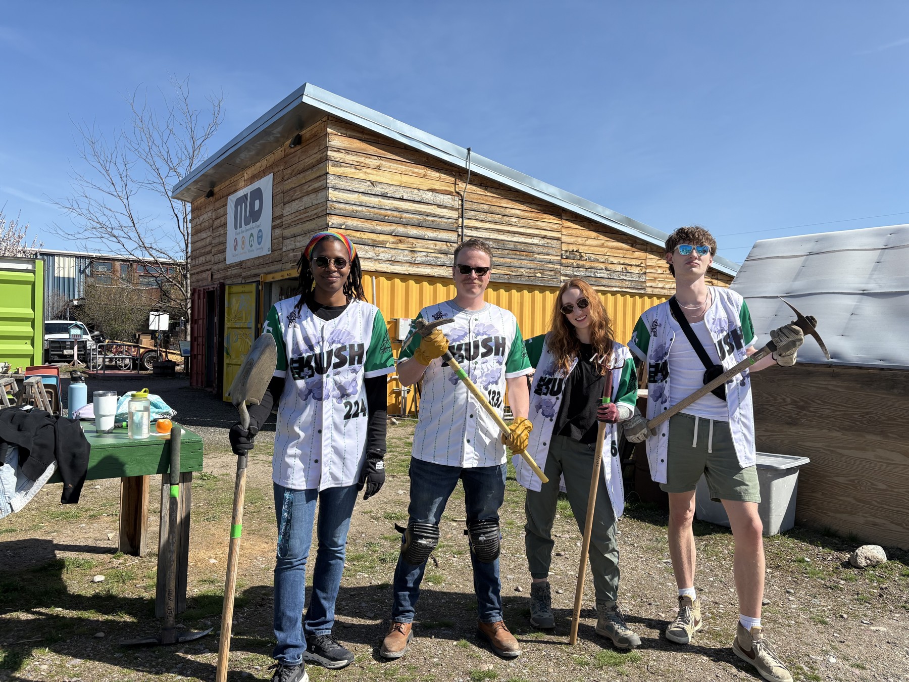 Montana Kush volunteer crew with tools during a community cleanup